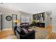 Elegant living room with hardwood floors, a built-in bar, and comfortable seating at 213 N Hesperides St, Tampa, FL 33609
