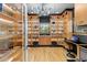 Well-lit office with custom built-in shelving, a glass display case, and sleek furnishings at 213 N Hesperides St, Tampa, FL 33609