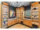 Elegant office with custom shelving, modern lighting, and dark accent walls at 213 N Hesperides St, Tampa, FL 33609