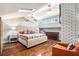 This primary bedroom features a skylight, vaulted ceiling, and a tufted headboard at 2134 Serpentine S Cir, St Petersburg, FL 33712