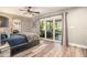 This large bedroom features a glass door leading to the patio at 2134 Serpentine S Cir, St Petersburg, FL 33712