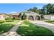 Beautiful single-Gathering home featuring a well-manicured lawn and an attached two-car garage at 2134 Serpentine S Cir, St Petersburg, FL 33712