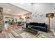 Open-concept living and dining areas with wood floors, high ceilings, and ample natural light at 2134 Serpentine S Cir, St Petersburg, FL 33712