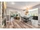 Inviting open-concept area joining the living room and dining room, accentuated with hardwood floors at 2134 Serpentine S Cir, St Petersburg, FL 33712