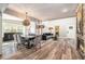 Open-concept living room featuring hardwood floors, a dining table, and modern furniture at 2134 Serpentine S Cir, St Petersburg, FL 33712