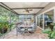 Covered patio featuring outdoor dining, ceiling fan, and outdoor grill at 2134 Serpentine S Cir, St Petersburg, FL 33712