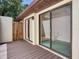 Balcony with wood floor and view into house at 2217 High Point Dr, Brandon, FL 33511