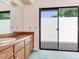 Bathroom with vanity and sliding glass doors to deck at 2217 High Point Dr, Brandon, FL 33511