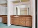 Bathroom with double sink vanity and large mirror at 2217 High Point Dr, Brandon, FL 33511