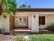 Front entrance with double glass doors and stone accents at 2217 High Point Dr, Brandon, FL 33511