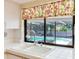 Kitchen sink with a window view of the covered outdoor patio and pool at 2217 High Point Dr, Brandon, FL 33511