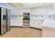 The renovated kitchen offers stainless appliances, white cabinets and countertops, and a skylight at 2217 High Point Dr, Brandon, FL 33511