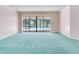 Living room with large sliding glass doors overlooking pool at 2217 High Point Dr, Brandon, FL 33511