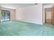 Living room with sliding glass doors leading to a pool, and neutral walls at 2217 High Point Dr, Brandon, FL 33511