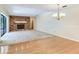 Spacious living room with stone fireplace and sliding glass doors leading to the lanai and pool at 2217 High Point Dr, Brandon, FL 33511