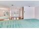 Living room with large sliding glass doors to entranceway at 2217 High Point Dr, Brandon, FL 33511