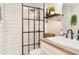 Modern bathroom featuring sleek black fixtures and stylish tile shower at 2403 Nantucket Field Way # 27, Sun City Center, FL 33573