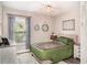 Relaxing bedroom with natural light, neutral decor, and modern furnishings at 2403 Nantucket Field Way # 27, Sun City Center, FL 33573