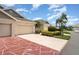 Attractive villa boasting a well-maintained exterior and colorful landscaping at 2403 Nantucket Field Way # 27, Sun City Center, FL 33573
