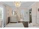 Airy bedroom featuring dark hardwood floors, large rug, walk-in closet and neutral wall paint at 2403 W Sunset Dr, Tampa, FL 33629
