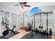 Bright gym with exercise bike, weight rack, and large windows offering natural light, perfect for a home fitness center at 2403 W Sunset Dr, Tampa, FL 33629