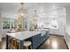 Spacious kitchen featuring a large island, modern appliances, and an adjacent dining area at 2403 W Sunset Dr, Tampa, FL 33629