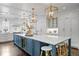 Stunning kitchen with a large island, modern appliances, and stylish pendant lighting at 2403 W Sunset Dr, Tampa, FL 33629