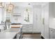 Elegant kitchen with white cabinets, modern appliances, and a large island at 2403 W Sunset Dr, Tampa, FL 33629