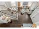 Elegant living room featuring hardwood floors, a staircase, a dining area, and sophisticated decor at 2403 W Sunset Dr, Tampa, FL 33629