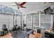 Workout room with a ceiling fan, lots of windows, and free weights at 2403 W Sunset Dr, Tampa, FL 33629