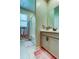 Bright bathroom featuring a modern vanity and shower-tub combination with stylish fixtures at 2456 Arbor Wind Dr, Lutz, FL 33558