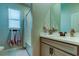 Well-lit bathroom featuring a modern vanity and shower-tub combination with stylish fixtures at 2456 Arbor Wind Dr, Lutz, FL 33558