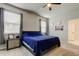 Comfortable bedroom showcasing natural light and easy access to the bathroom at 2456 Arbor Wind Dr, Lutz, FL 33558