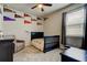 Comfortable bedroom with a black crib with sports themed decoration at 2456 Arbor Wind Dr, Lutz, FL 33558