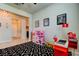 Playroom with a geometric rug and a variety of toy kitchen and checkout stand at 2456 Arbor Wind Dr, Lutz, FL 33558