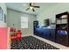 Playroom with a geometric rug, ceiling fan, and ample storage space at 2456 Arbor Wind Dr, Lutz, FL 33558