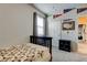 Comfortable bedroom with a black crib and carpet floor at 2456 Arbor Wind Dr, Lutz, FL 33558