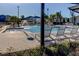 Inviting community pool area with fountain feature and lounge chairs, perfect for relaxation and socializing at 2456 Arbor Wind Dr, Lutz, FL 33558