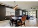 Dining room featuring neutral decor, stylish lighting, and an open layout leading to living area at 2456 Arbor Wind Dr, Lutz, FL 33558