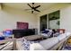 Relaxing covered patio featuring a comfortable seating area and outdoor entertaining space at 2456 Arbor Wind Dr, Lutz, FL 33558