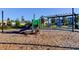 Community playground features a slide, climbing area, shaded pergola, and benches, offering a fun outdoor space at 2456 Arbor Wind Dr, Lutz, FL 33558