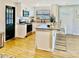 Eat-in kitchen with breakfast bar, granite countertops and stainless steel appliances at 2606 E 97Th Ave, Tampa, FL 33612