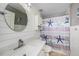 Updated bathroom featuring shiplap walls and stylish vanity at 2611 San Luis Rd, Holiday, FL 34691
