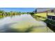 Scenic waterfront view showcasing a tranquil canal with lush greenery and a glimpse of nearby houses at 2611 San Luis Rd, Holiday, FL 34691