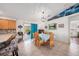 Bright dining area with wicker chairs, tiled floors, and access to patio at 2611 San Luis Rd, Holiday, FL 34691