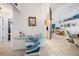 Inviting entryway featuring an art display, leading to a dining area with coastal decor and nautical charm at 2611 San Luis Rd, Holiday, FL 34691
