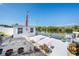 Waterfront property featuring dock, shed, and landscaping for enjoying the outdoors and canal views at 2611 San Luis Rd, Holiday, FL 34691