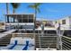 Waterfront home featuring a dock, patio, sunroom, and beautiful canal views for Florida living at 2611 San Luis Rd, Holiday, FL 34691