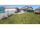 Charming single-story home featuring well-manicured lawn and white picket fence at 2611 San Luis Rd, Holiday, FL 34691