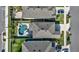 Aerial view showcasing a beautiful home with a private backyard featuring a pool and patio area at 28809 S Orange Berry S Dr, Wesley Chapel, FL 33543